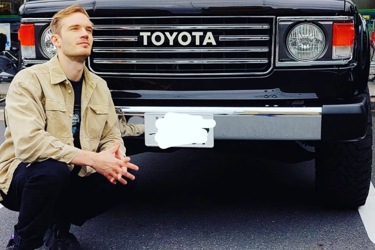 YouTuber PewDiePie poses with car