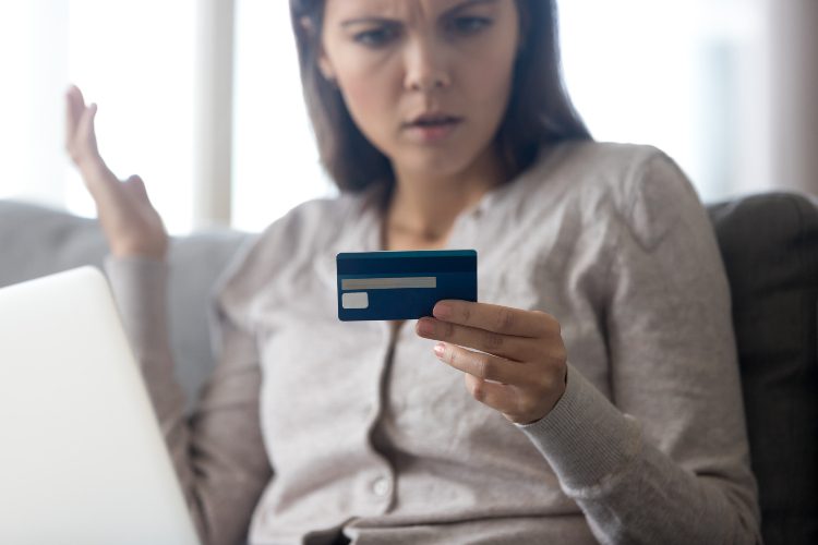 woman frustrated at credit card